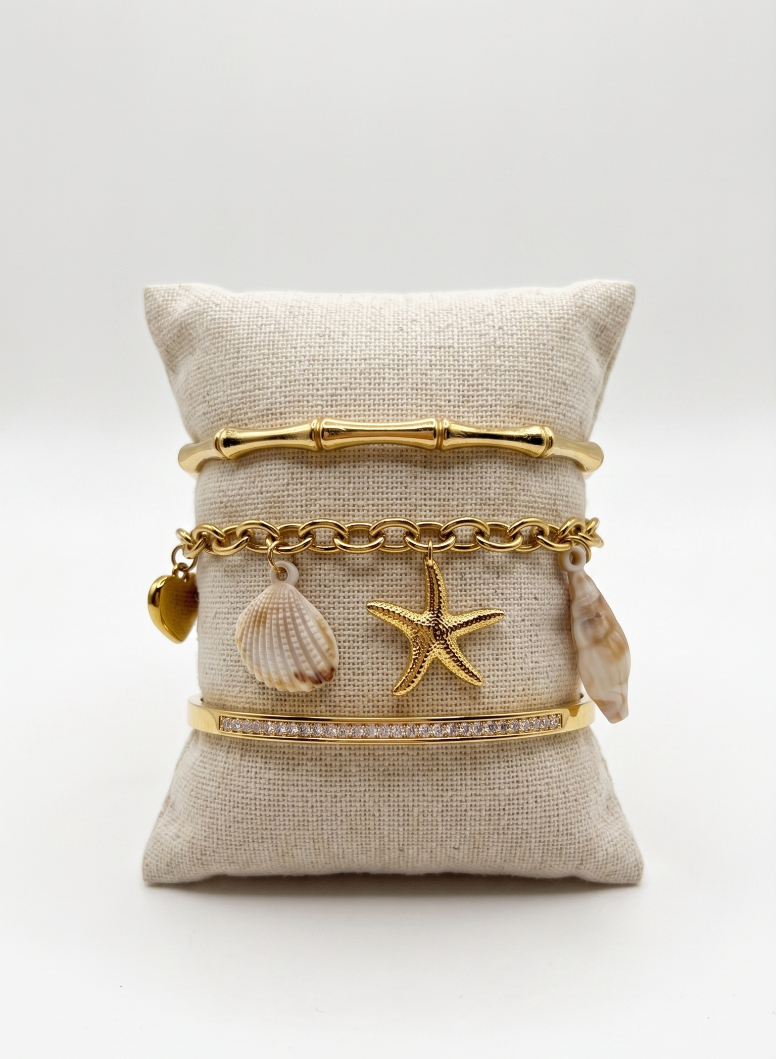 Composition Calypso jonc doré et bracelet coquillage